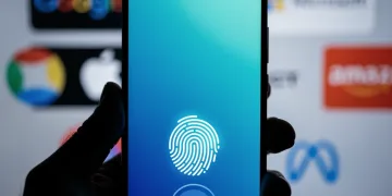Fingerprint scanning on a smartphone for passkey authentication, securing multiple digital accounts.